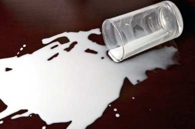 spilt-milk-on-dark-table.jpg